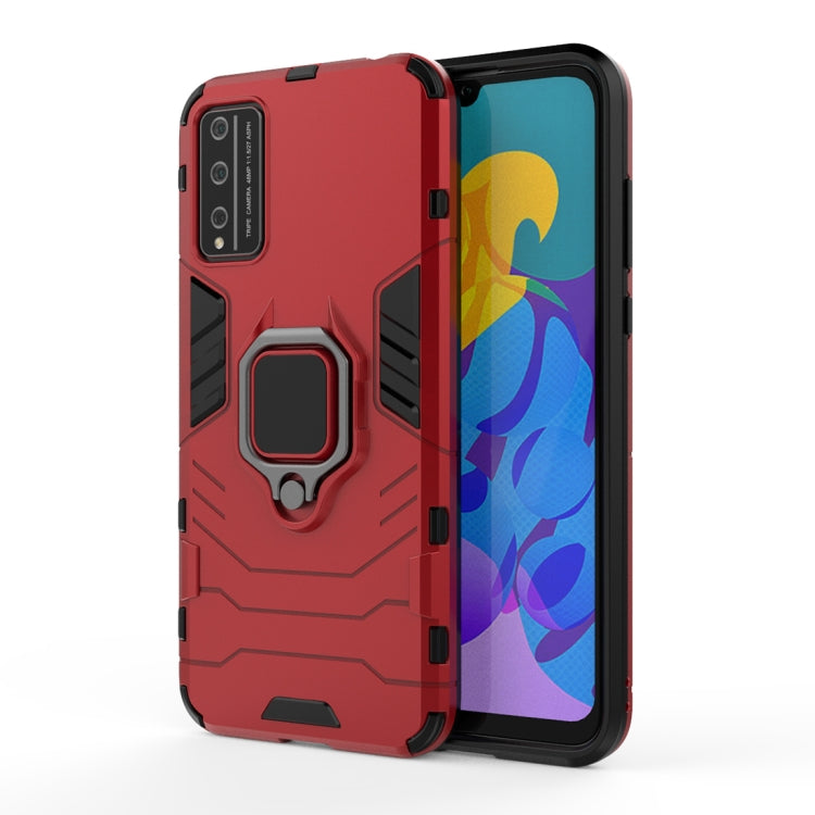 Red rugged phone case with magnetic ring holder and raised camera protection.
