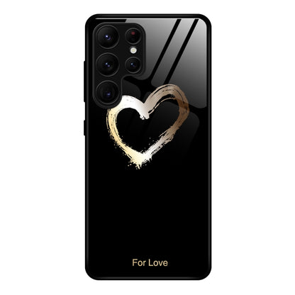 Painted glass phone case with gold heart on dark background