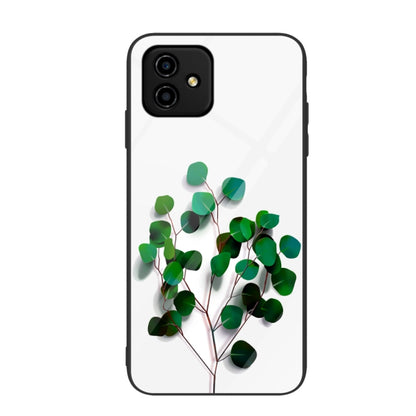 Glass phone case with green leaf branch graphic on white background