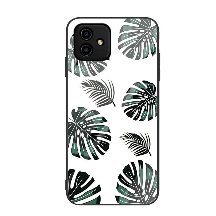 Painted glass phone case with black and green tropical leaf pattern