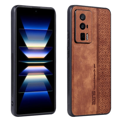 Brown phone case with embossed geometric pattern, leather-like texture, and camera cutouts