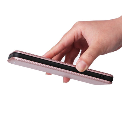 Pink flip phone case held in hand, showing side button and port cutouts