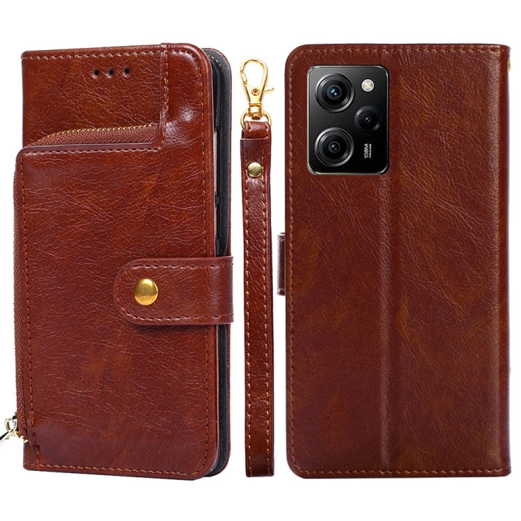 Brown leather zipper phone case with folio flap, magnetic strap, and wrist-zip pull.