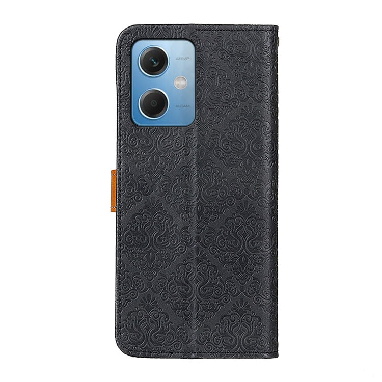 Black embossed leather phone case with floral pattern, rear camera cutouts