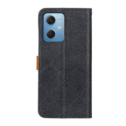 Black embossed leather phone case with floral pattern, rear camera cutouts