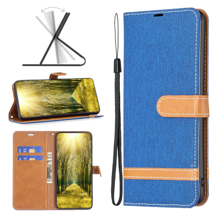 Royal blue denim-texture leather phone case with tan wrist strap and stitched accents