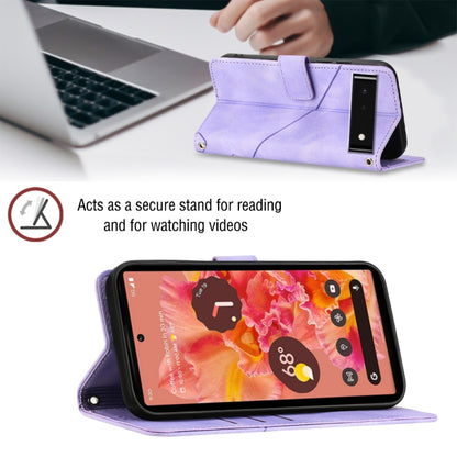 Light purple embossed leather folio phone case acting as a viewing stand