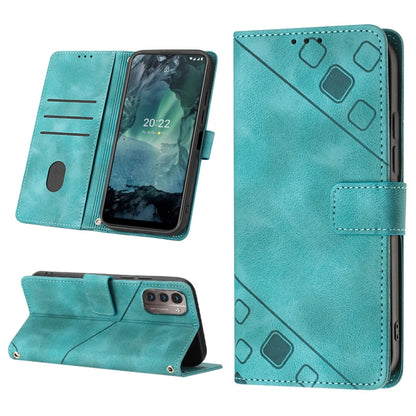 Teal embossed leather folio phone case with stand, card slots, and raised geometric motifs