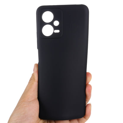 Black liquid silicone phone case with raised camera cutouts, hand-held