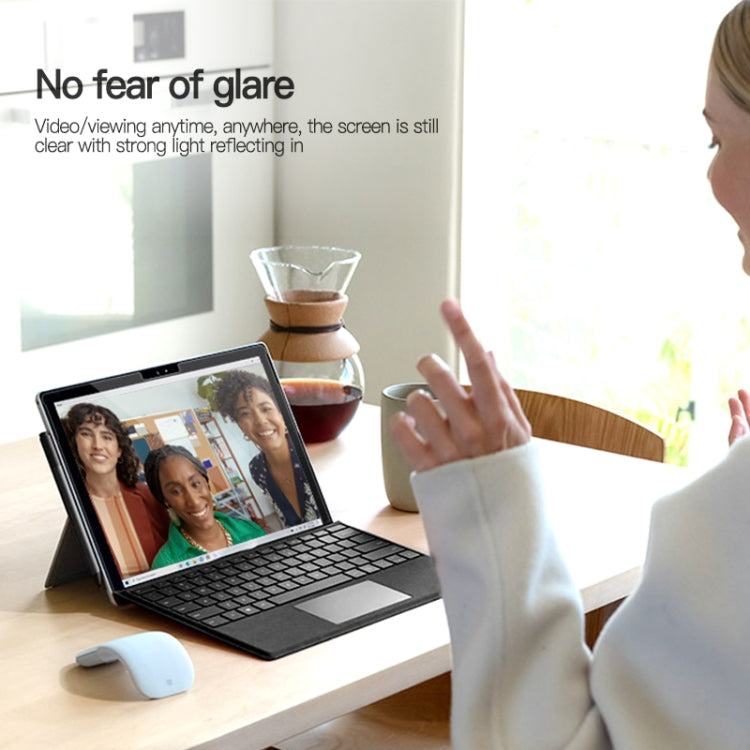 AR screen film on a tablet with hands in a workspace setting