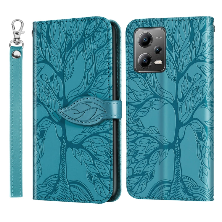 Leather phone case with embossed tree pattern, teal, with wrist strap