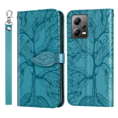 Leather phone case with embossed tree pattern, teal, with wrist strap