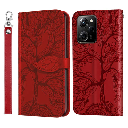 Red embossed leaf pattern wallet phone case with long wrist strap and magnetic flip cover
