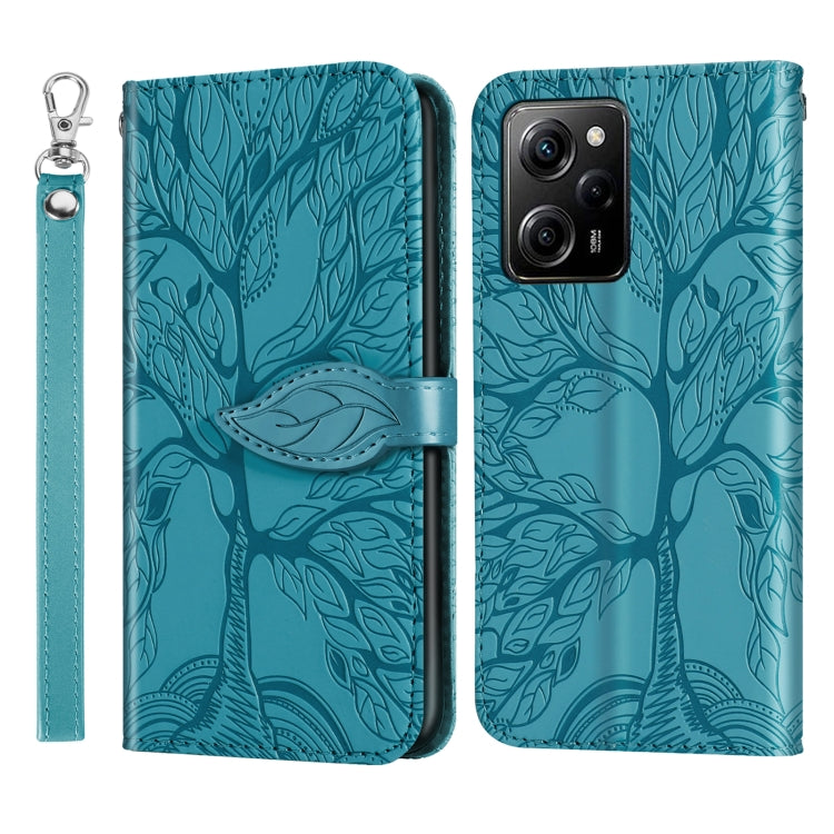 Leather phone case with embossed tree pattern, teal, camera cutouts and wrist strap