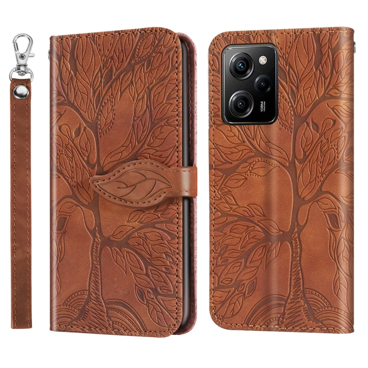 Leather phone case with embossed tree pattern, brown, camera cutouts and wrist strap