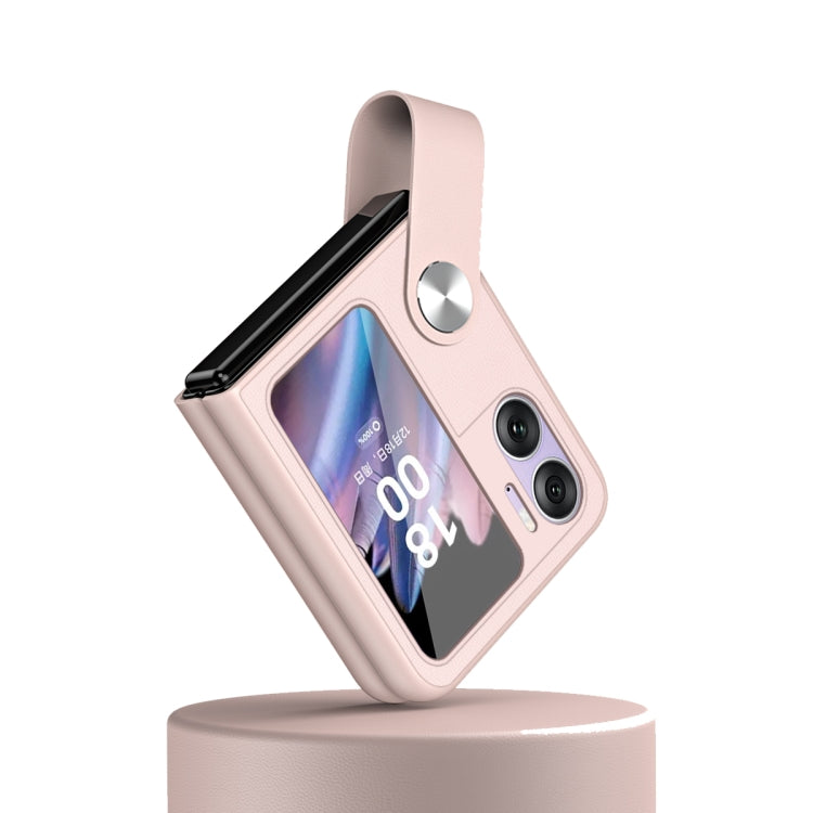 Pink leather-style phone case with hand strap and dual camera cutouts for flip phone