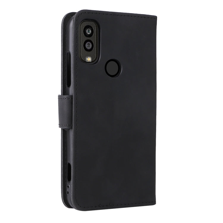 Black leather flip phone case with camera cutout and side grip strap