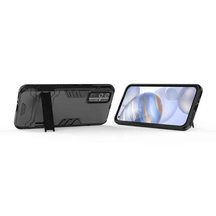 Black rugged protective phone case with invisible holder, angled stand view