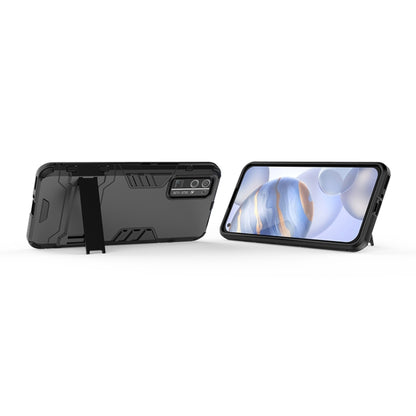 Black rugged protective phone case with invisible holder, angled stand view
