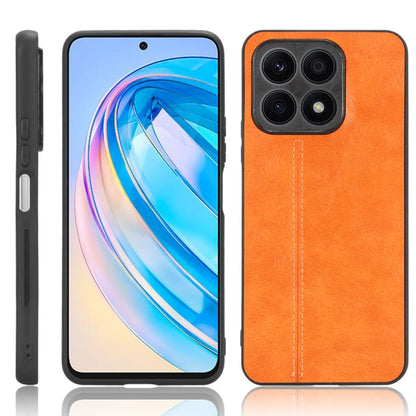 Textured orange leather-style phone case with multiple camera cutouts and edges