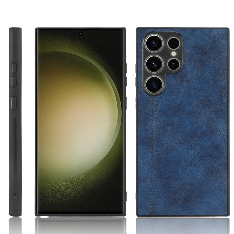 Blue leather-look phone case with triple camera cutouts and stitched edge