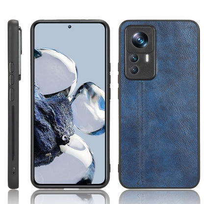 Blue leather-look phone case with raised camera area and cutouts
