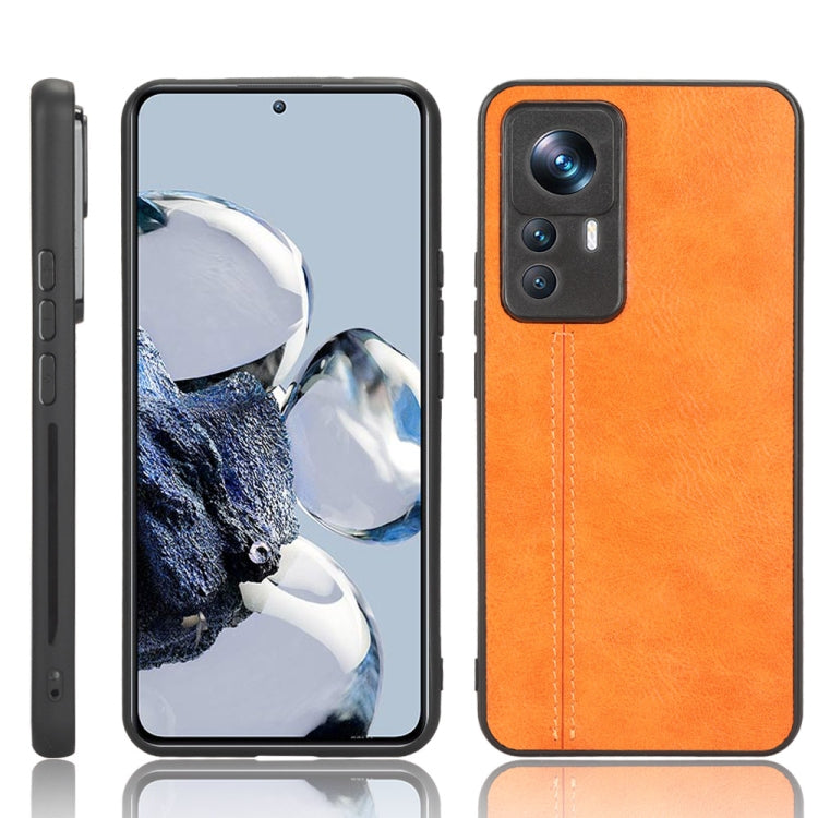 Orange leather-look phone case with textured finish and camera cutouts