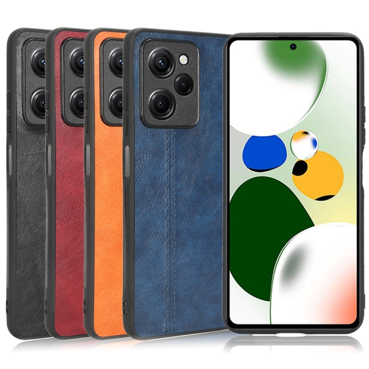 Cow motif and textured phone cases in black, red, orange, and blue