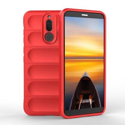 Red TPU phone case with raised edges, camera cutout, and rugged grip texture.