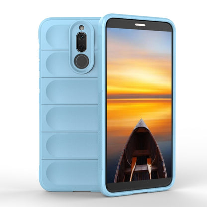 Light blue TPU phone case with raised edges, camera cutout, and rugged grip texture.