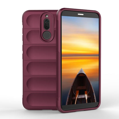 Wine red TPU phone case with raised edges, camera cutout, and rugged grip texture.