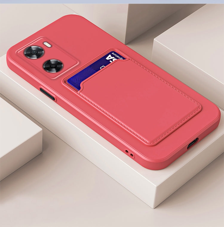 Magenta TPU phone case with contrast card slot and button-style camera cutouts