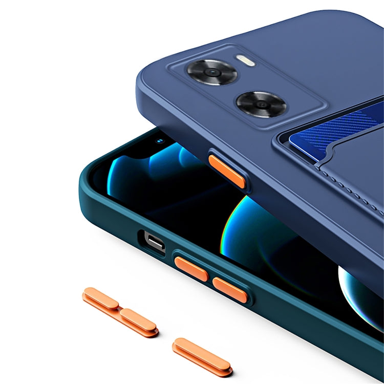 Navy TPU phone case with blue interior and orange side buttons.