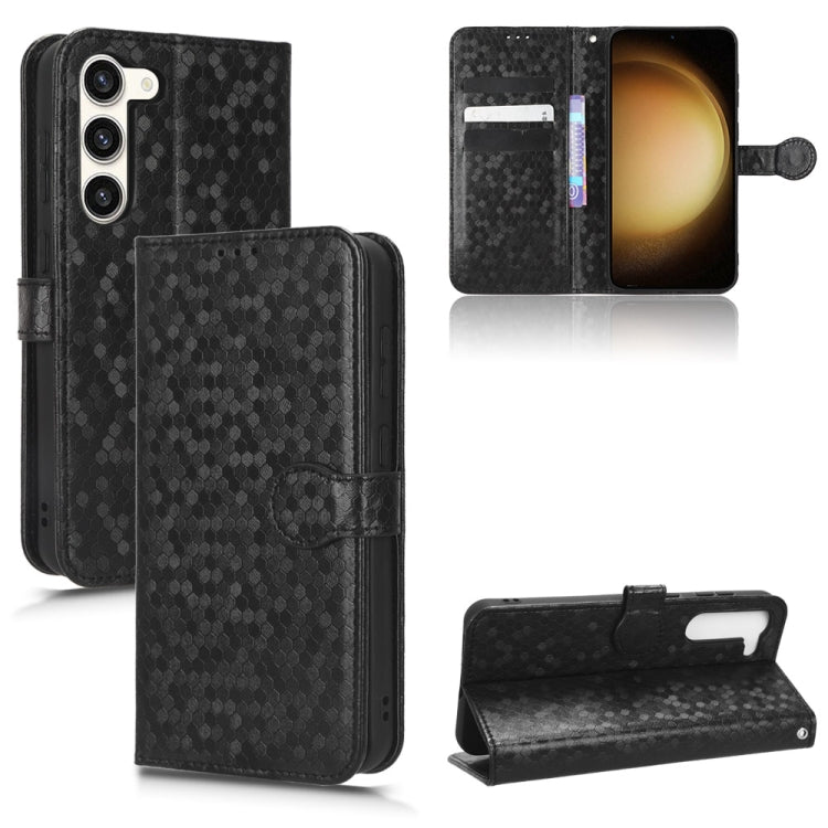 Black honeycomb dot leather phone case with folio cover, card slots, and wrist strap
