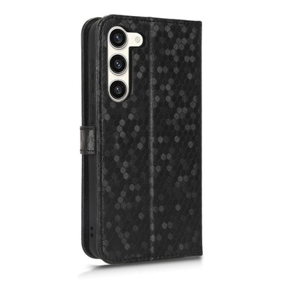 Black honeycomb dot leather phone case with side strap and raised camera cutouts