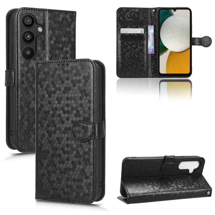 Black honeycomb dot leather phone case with folio cover and side wrist strap attachment