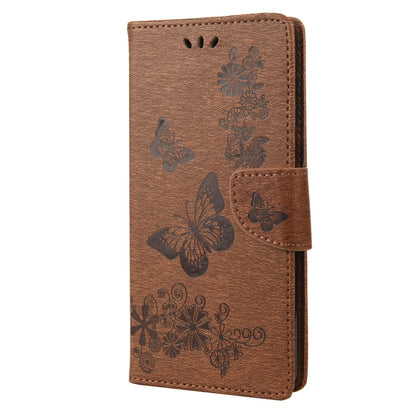 Brown butterfly embossed flip leather phone case, front view with side clasp