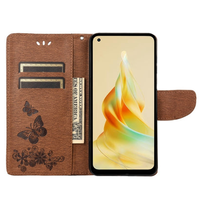 Brown butterfly embossed flip leather phone case opened, showing card slots and strap