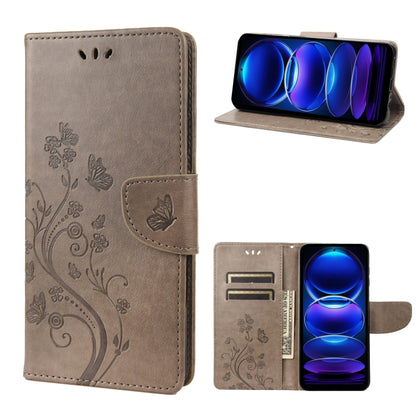 Light gray leather phone wallet case with butterfly-and-flower pattern, folio stand, card slots