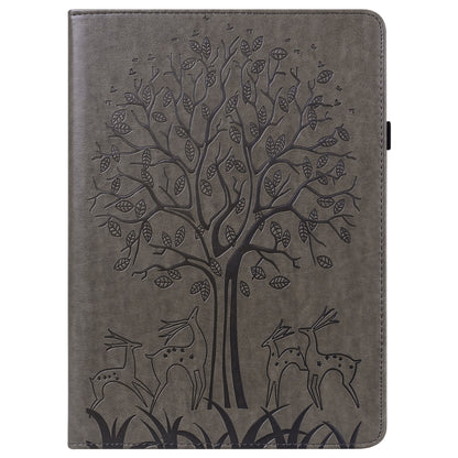 Grey embossed leather-style tablet case with tree and deer pattern, front view