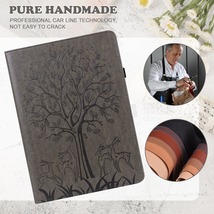 Grey embossed leather-style tablet case with tree and deer pattern, folio cover shown