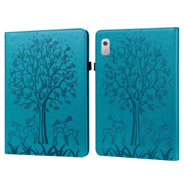 Blue embossed leather-style tablet case with tree and deer pattern, front cover closed