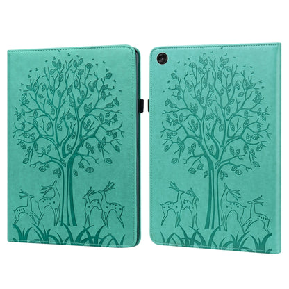 Green embossed leather-style tablet case with tree and deer pattern, front cover closed