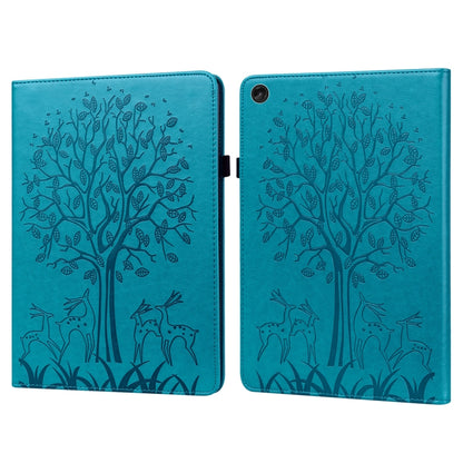 Blue embossed leather tablet case with tree and deer pattern, foldover cover