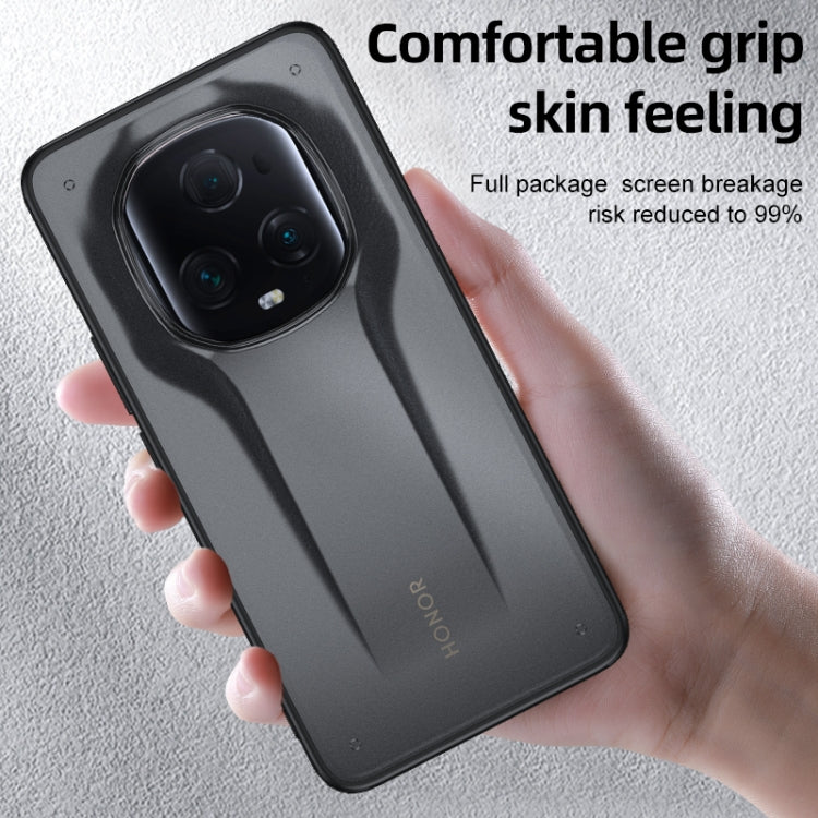 Matte black phone case held in hand with textured grip and camera opening