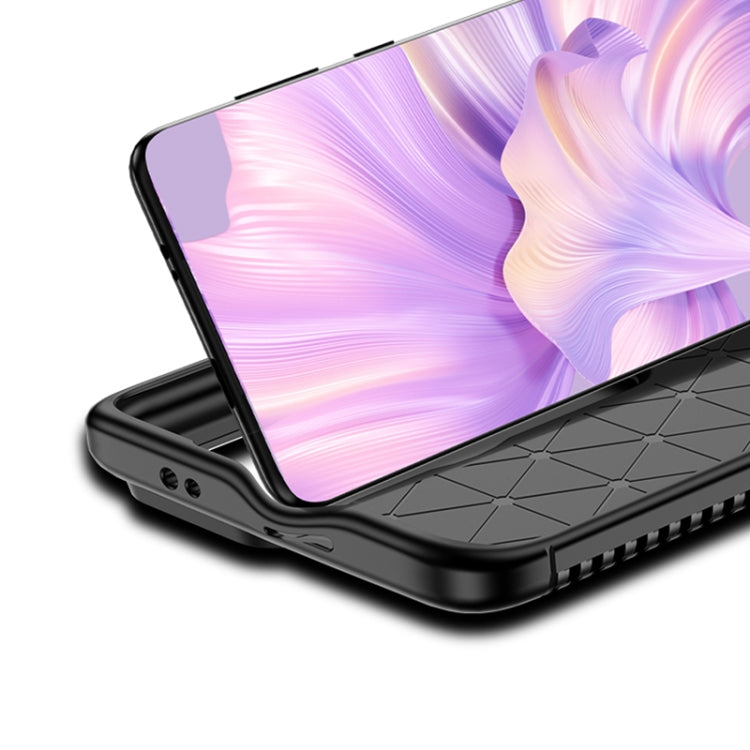 Black carbon-fiber textured TPU phone case with raised lip for screen protection.