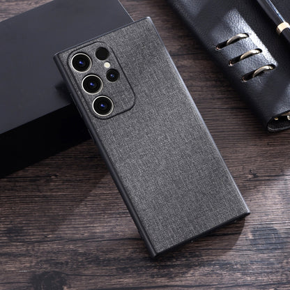 Grey cloth-texture phone case with cutouts for camera lenses and flash