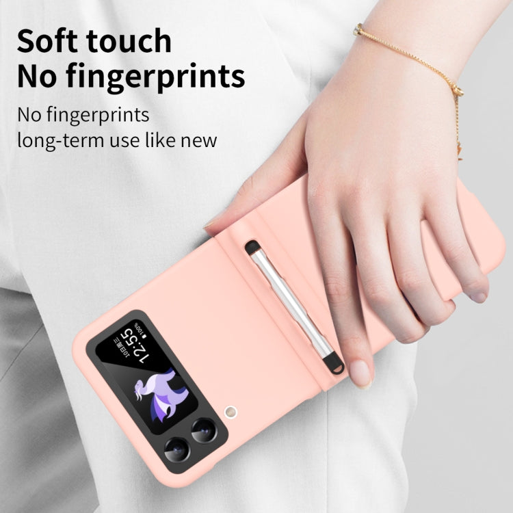 Pink soft-touch flip phone case with stylus and non-slip feel, held in hand