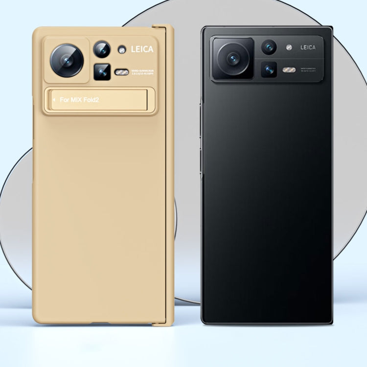 Two-piece folding phone case display: beige and black with hinge and stand