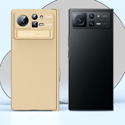 Two-piece folding phone case display: beige and black with hinge and stand